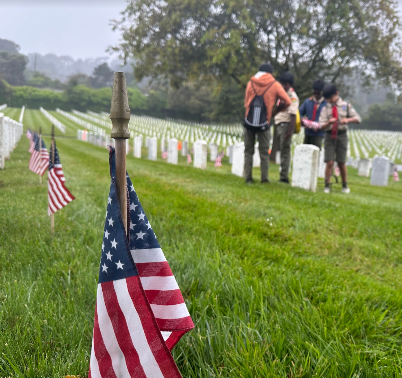 Troop 75 scouts planting flags for Memorial Day